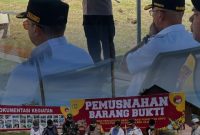 Sambutan oleh Kapolres Pohuwato AKBP Busroni dan proses Pemusnahan barang Bukti minuman beralkohol oleh anggota Polres Pohuwato